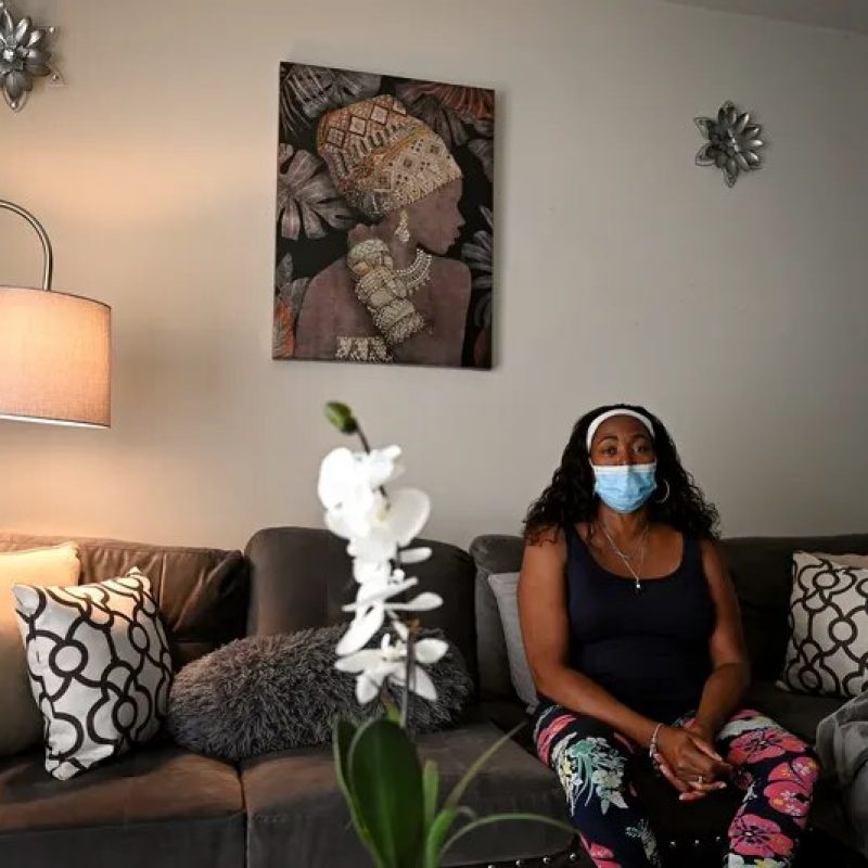 image of mother sitting in living room